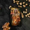 A tarot card is displayed on a dark surface surrounded by gold stones and a crystal formation. Voir les images du produit