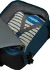 Inside of a backpack with a striped shirt folded. Produktbild-Vorschau