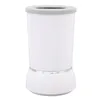 A white automatic dog paw cleaner with a gray rim and a silver band around the base. Voir les images du produit
