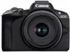 A front view of a black Canon EOS R50 mirrorless camera with a lens attached, set against a white background. Voir les images du produit