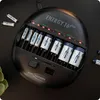A black battery charger with multiple batteries inserted. Anteprima dell’immagine prodotto