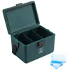 A green cooler box with its lid open, showing three compartments inside. Several blue ice packs are placed next to the box on a white background. Produktbild-Vorschau