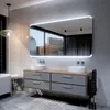 A modern bathroom with a double vanity, large illuminated mirror, and a bathtub. Produktbild-Vorschau
