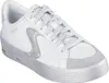 A white Skechers sneaker with silver accents and a silver sole, shown from a side-angle against a white background. Produktbild-Vorschau