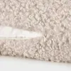 A close-up view of a textured pillow cover with a zipper. Produktbild-Vorschau