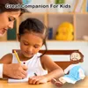 A woman is helping a young girl with her homework, with a plush doll of Jesus sitting on the table. Produktbild-Vorschau