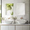A modern bathroom vanity with two sinks and mirrors. Produktbild-Vorschau