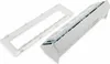 A white multi-outlet power strip and a white frame are shown against a white background. Produktbild-Vorschau