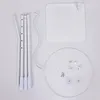 A flat lay of a disassembled white stand with its components laid out. Produktbild-Vorschau