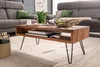 A living room scene with a coffee table, sofa, and artwork. Náhled obrázku produktu