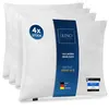 A stack of four white pillows with a blue and white label on the front pillow. Produktbild-Vorschau