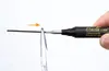 A hand holding a marker and scissors, with an arrow indicating movement. Produktbild-Vorschau