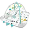 A baby play mat with an overhead gym structure and hanging toys, featuring a dinosaur theme. Anteprima dell’immagine prodotto