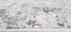 A close-up view of a rug with a distressed pattern. Produktbild-Vorschau