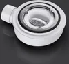 A close-up studio shot of a white shower drain assembly with a silver grate, set against a dark, reflective background. Voir les images du produit