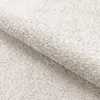 A close-up view of a textured, cream-colored bouclé fabric, likely a sofa or upholstery material. Podgląd zdjęcia produktu