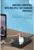 A laptop and a power strip with a charger are shown on a wooden desk. Produktbild-Vorschau