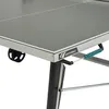A close-up view of a table tennis table, showing the edge and a handle. Produktbild-Vorschau