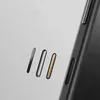 A close-up shot of a black phone case with three metallic accents on a light gray background. Produktbild-Vorschau