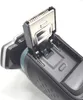 Close-up view of an open electric shaver, showing the cutting head and internal mechanism. Produktbild-Vorschau