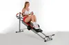 A woman is using a home exercise machine. Produktbild-Vorschau