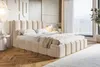 A bedroom scene featuring a large upholstered bed. Náhled obrázku produktu