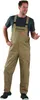 A man wearing khaki overalls and a dark t-shirt stands against a white background. Produktbild-Vorschau