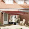 An outdoor patio scene with a retractable awning extended over a seating area. Produktbild-Vorschau