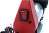 A close-up view of a red electrical switch on a device. Náhled obrázku produktu
