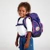 A young girl wearing a backpack. Produktbild-Vorschau
