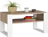 A coffee table with a plant, a cup of coffee, and a piece of cake on top. Voir les images du produit