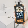 A hand holds an endoscope camera over a sink drain, showing a view of gears and an engine on the screen. Produktbild-Vorschau