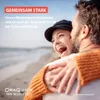 A couple embracing on a beach with text overlays. Produktbild-Vorschau
