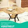 A round wooden dining table with a black metal base, set on a rug in a room. Produktbild-Vorschau