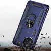 A blue phone case with a ring holder is shown at an angle, with debris falling around it to simulate impact. Produktbild-Vorschau