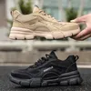 Two pairs of safety shoes, one tan and one black, are displayed against a blurred background. Produktbild-Vorschau