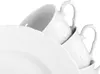 A close-up, studio shot of white porcelain cups and plates stacked together against a white background. Produktbild-Vorschau