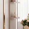 A close-up of a shelf with a diffuser and a jar of cream. Produktbild-Vorschau