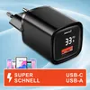 A close-up of a black USB charger with a digital display, accompanied by smaller images of mobile devices and promotional text. Produktbild-Vorschau