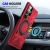 A red phone case with a magnetic ring stand is shown attached to a car vent mount inside a car. Produktbild-Vorschau