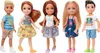 Five children's dolls are standing in a line against a white background. Podgląd zdjęcia produktu