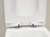 A close-up view of the top of a white toilet, showing the open lid and seat with visible hinges. Produktbild-Vorschau