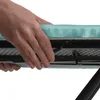A close-up shot of a hand adjusting the cover of an ironing board. Produktbild-Vorschau