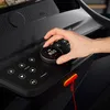 A hand is shown adjusting a dial on the control panel of a treadmill. Produktbild-Vorschau