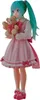A full-body shot of a Hatsune Miku figurine holding a teddy bear. Produktbild-Vorschau