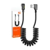 A black coiled Lightning data/charging cable with a 90-degree connector, shown with its packaging. Anteprima dell’immagine prodotto