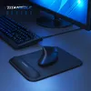A computer mouse and keyboard are shown on a desk with a monitor in the background, illuminated by blue light. Voir les images du produit