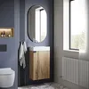 A modern bathroom with a wall-mounted vanity, toilet, and radiator. Voir les images du produit