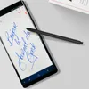 A stylus pen is shown resting on a smartphone screen displaying handwritten notes. Podgląd zdjęcia produktu