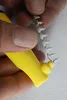 A close-up shot of a person's hands holding a yellow tool and a string of white fasteners. Produktbild-Vorschau